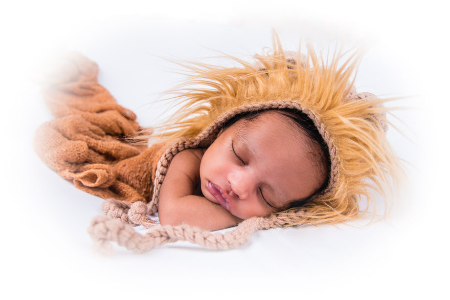 newborn boy in lion suit