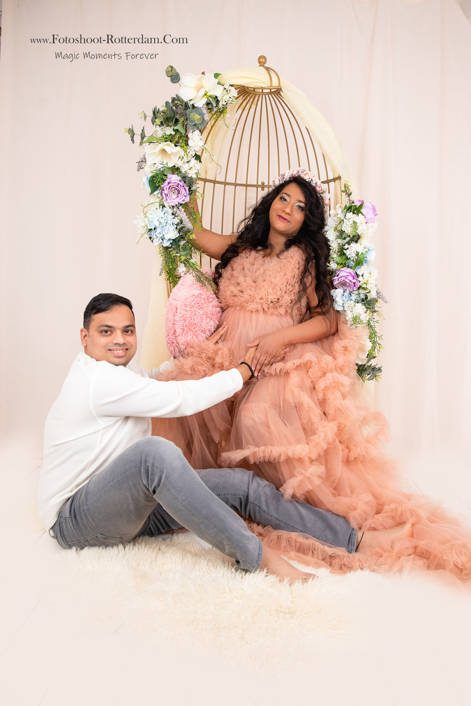 pregnant woman in cage with flowers