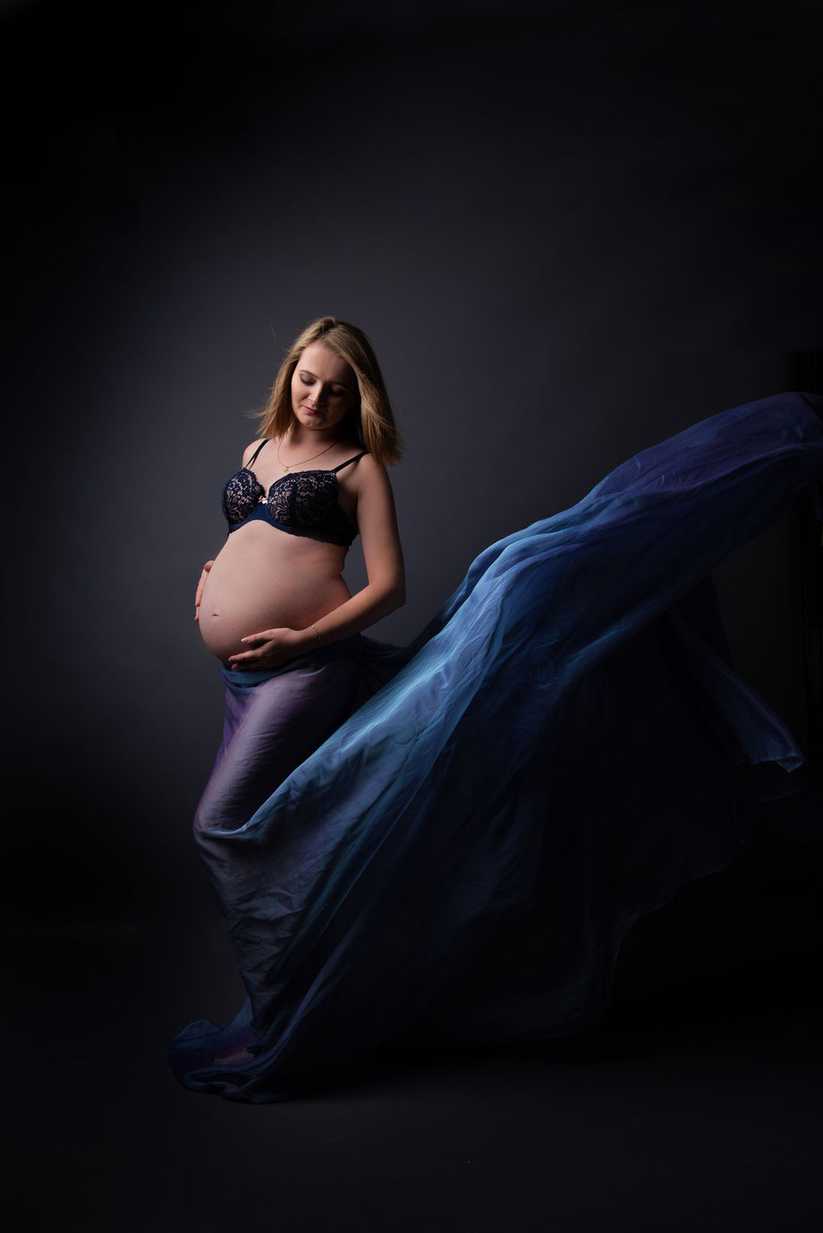 maternity dress in dark scenery