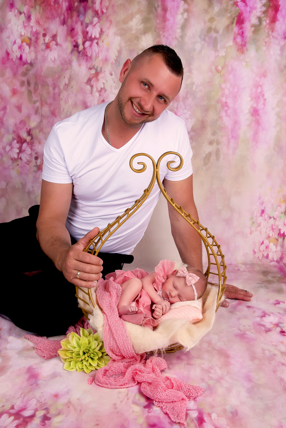 newborn girl with golden prop