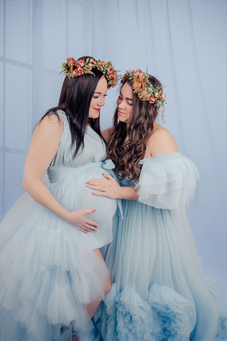blue dresses and flowers in maternity shoot