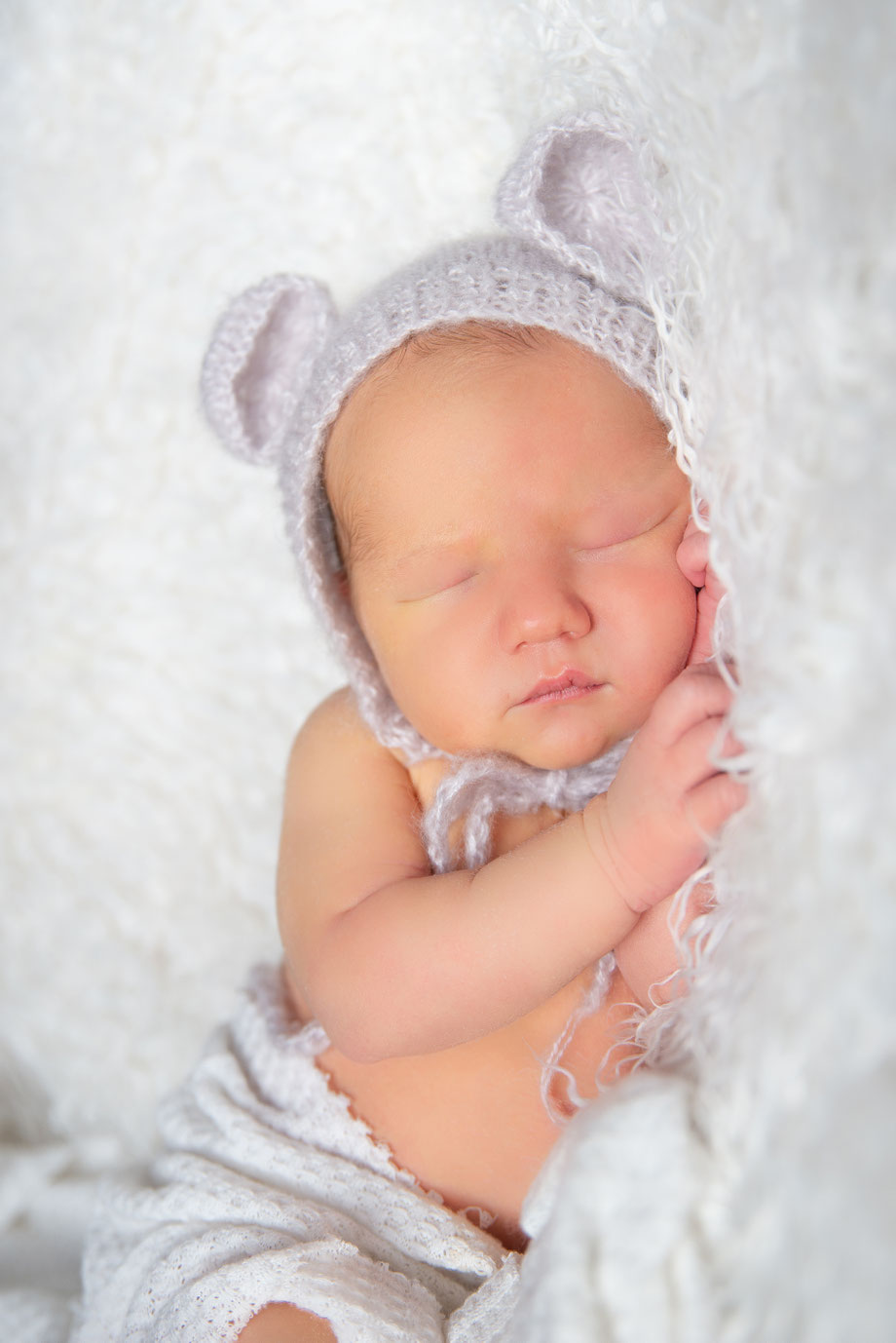 newborn in white clothes