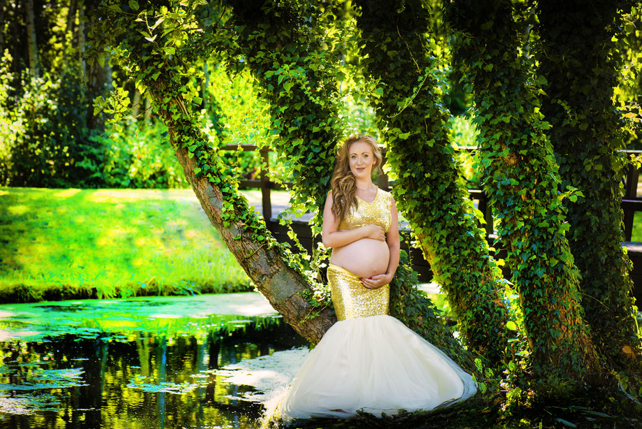 pregnant woman in golden dress