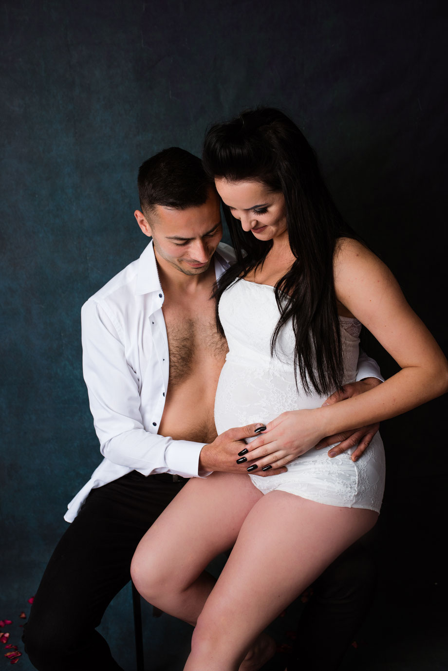 young couple in maternity shoot