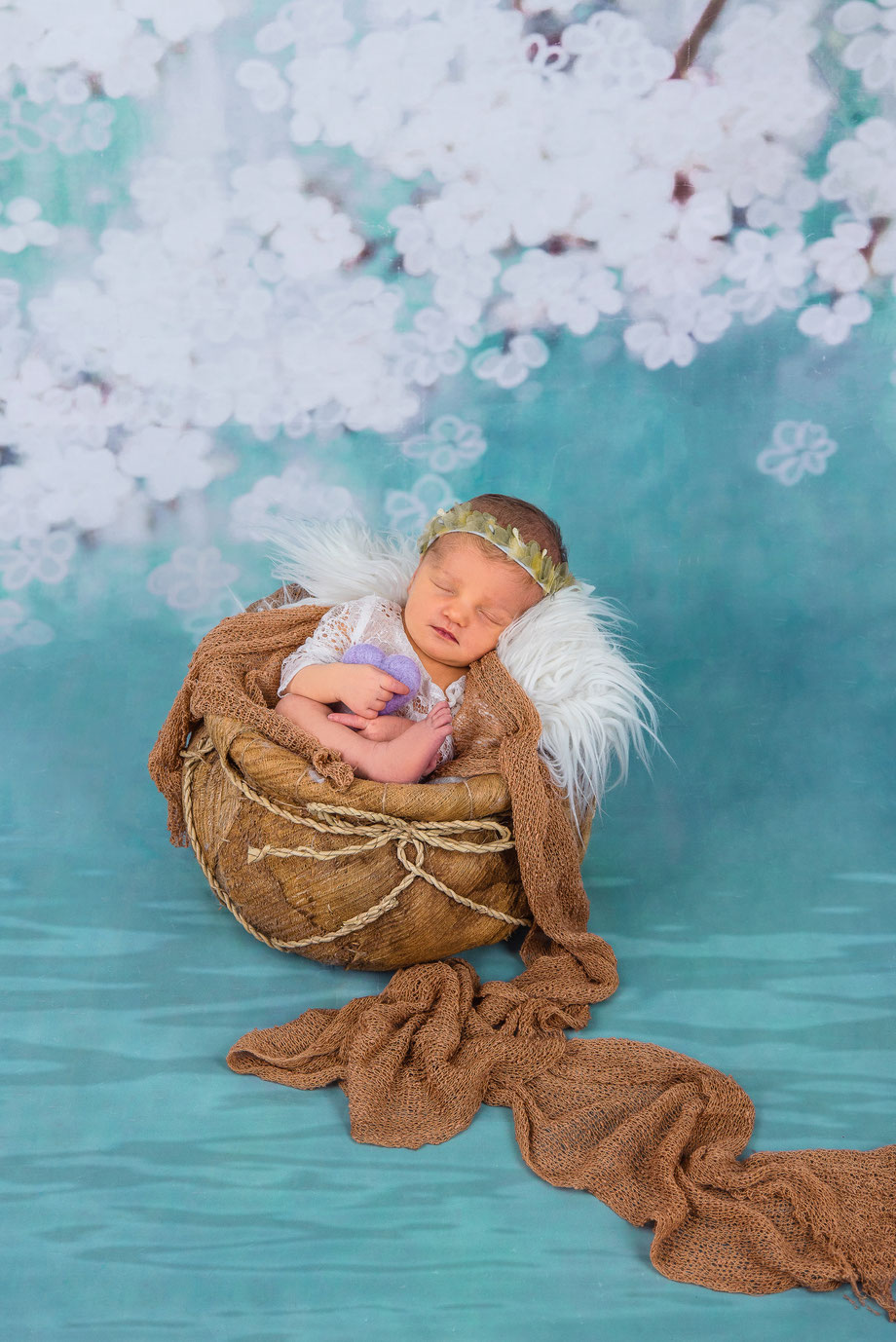 newborn with brown clothes