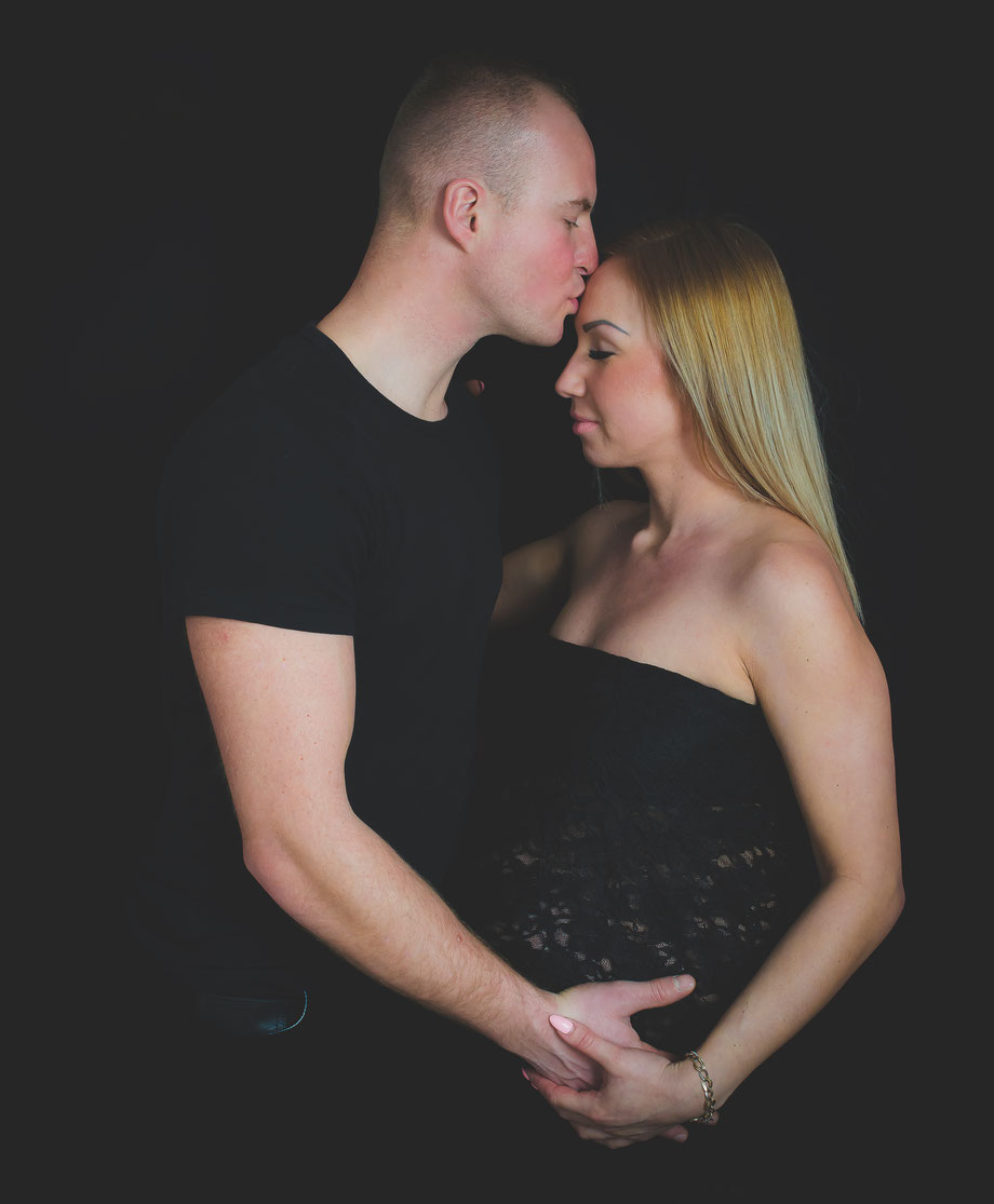 sensual couple during maternity shoot