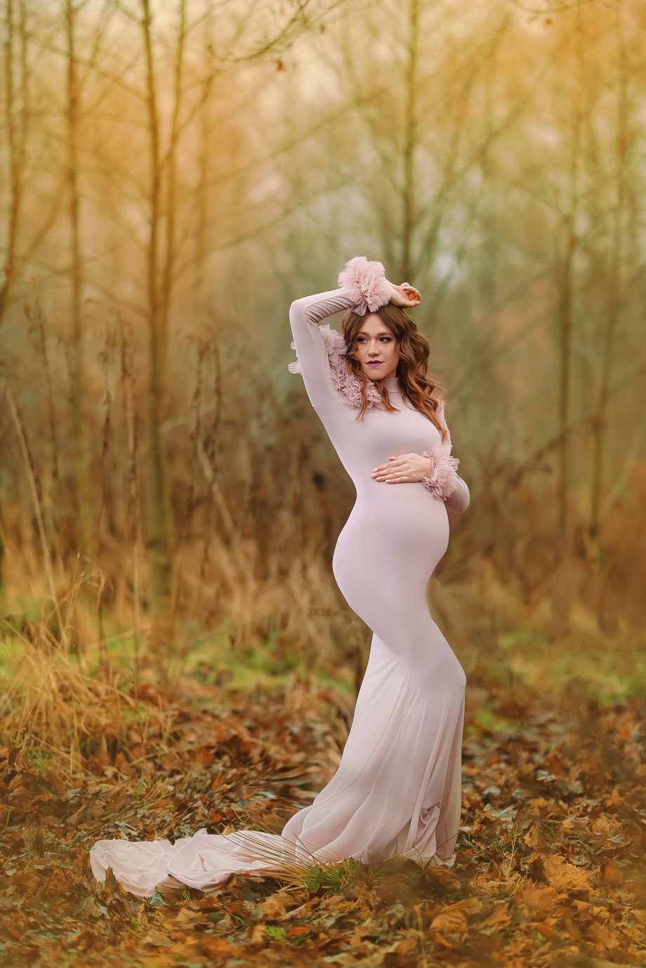 pregnant woman in autumn scenery