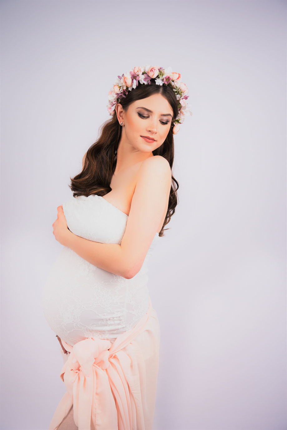 pregnant woman with flowers on head