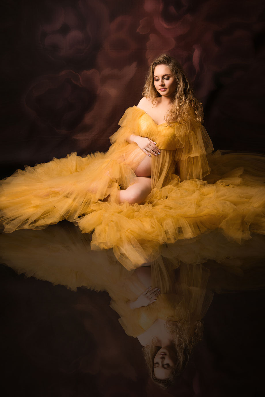 maternity shoot in golden dress