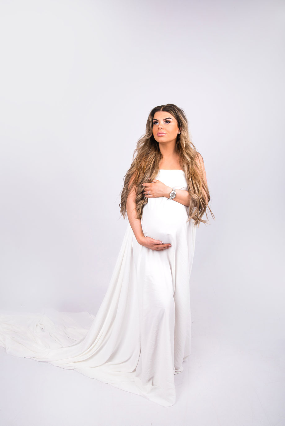 pregnant woman in huge white dress