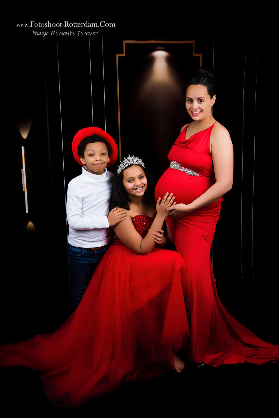 pregnant woman and family in red dresses