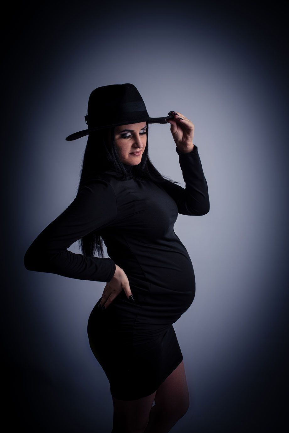 black hat and black maternity dress