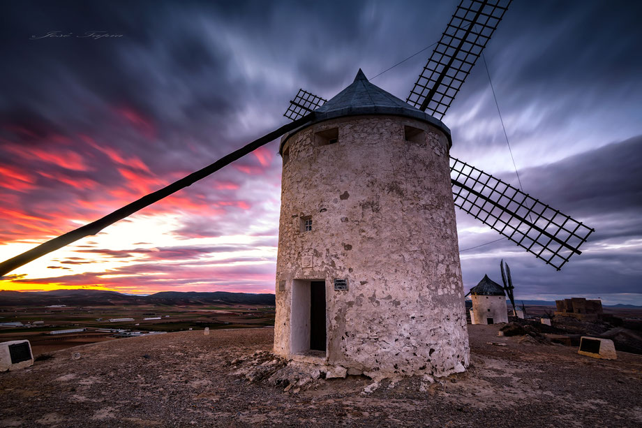               "PAST WINDS". La Mancha at sunset, Spain. 