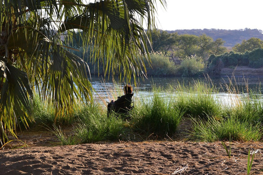 Pru sitting quietly on the banks of the Kunene