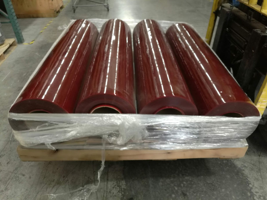 Rollos de Cortina roja transparente para celdas de soldadura.