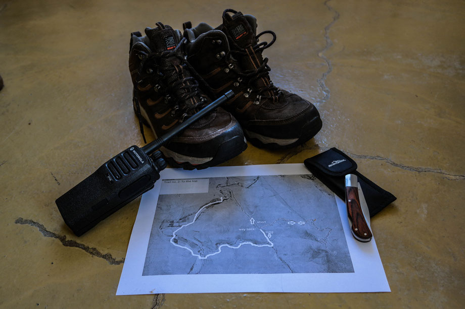 Prepared some stuff to take with me while hiking, climbing the mountain: good shoes, a knife, a map and a radio. South Africa