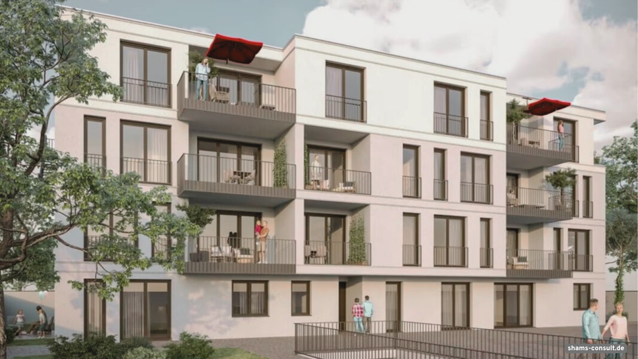 Dreistöckiges Mehrfamilienhaus mit großen Fenstern und Balkonen mit Bäumen davor in Dreieich Götzenhain