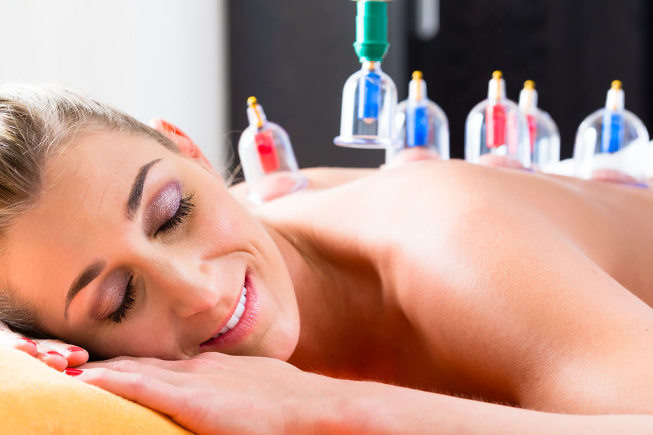 Woman enjoys relaxing cupping treatment