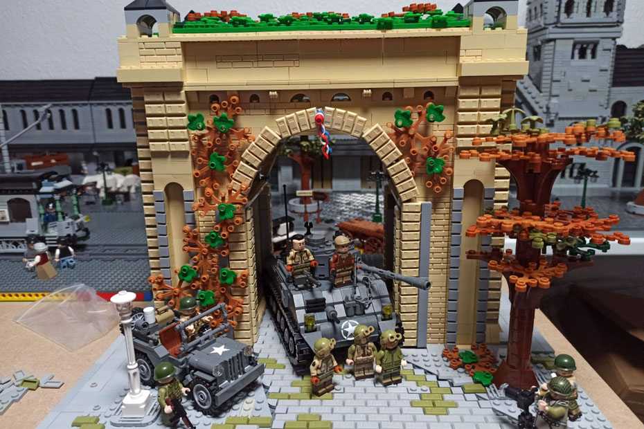 Reconstitution historique en briques LEGO® montrant soldats et civils autour du thème guerre et paix.