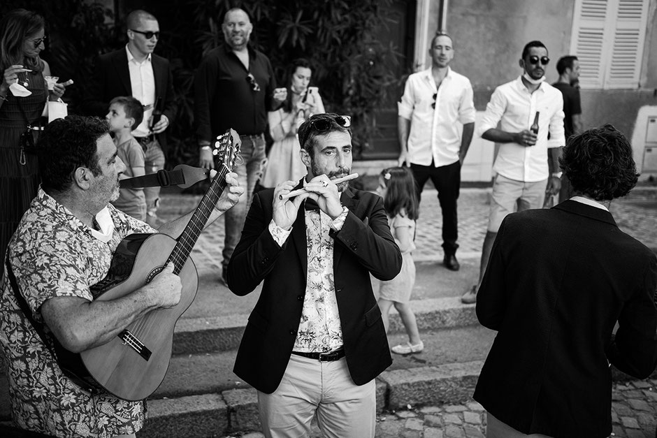 Jean Louis Mas, a native of Saint-Tropez, plays the fife during the cocktail hour of a traditional Tropézien wedding.
