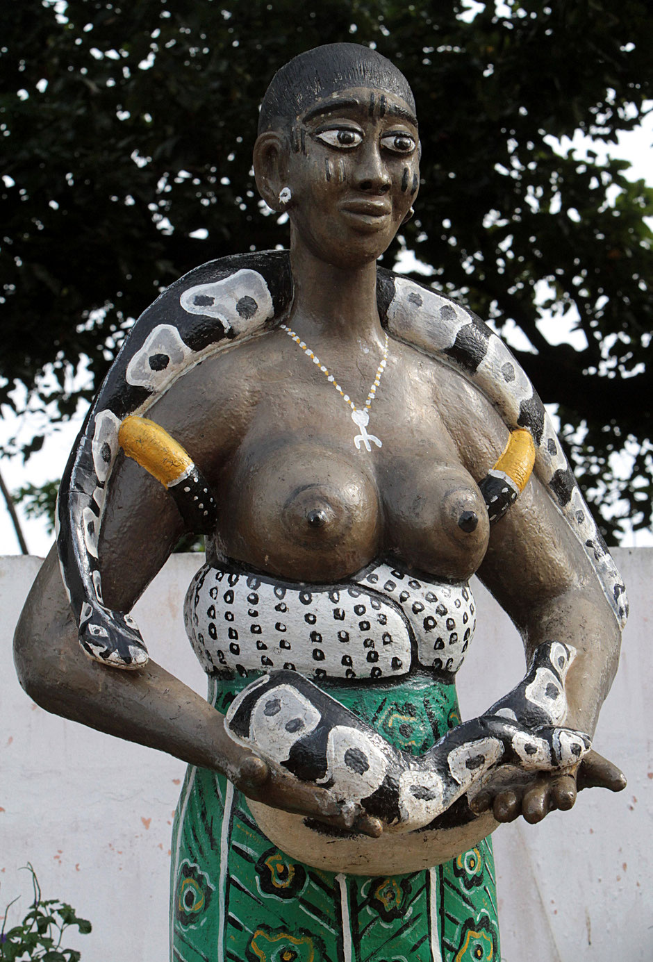 Standing African statue in front of the Voodoo Python temple. Ouidah.