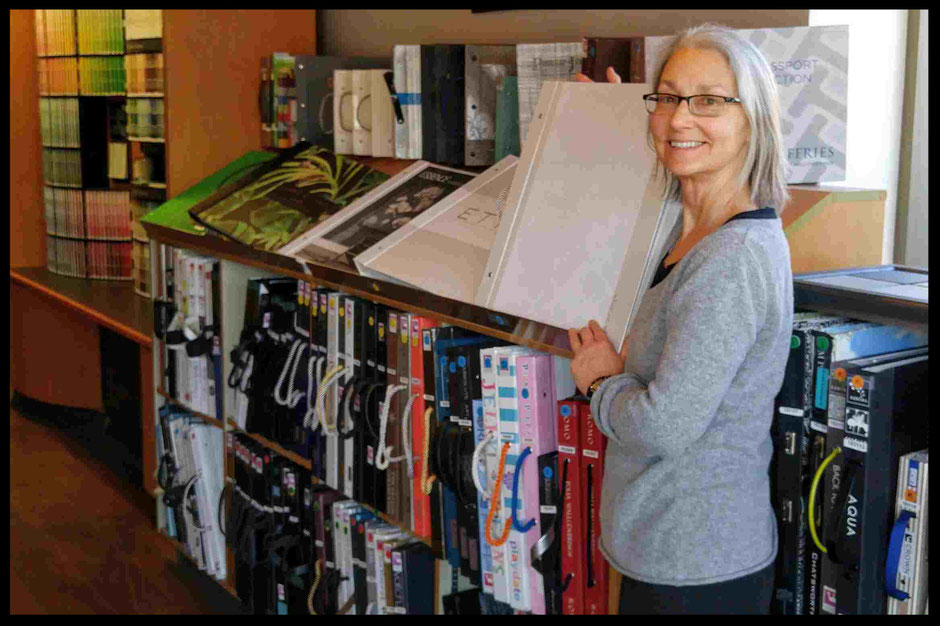 Manager Judith at Upper Village Paint & Wallpaper's Wallpaper books