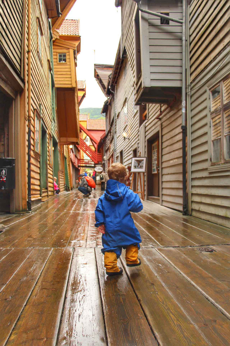 Alleys of Bryggen in Bergen Norway With a toddler