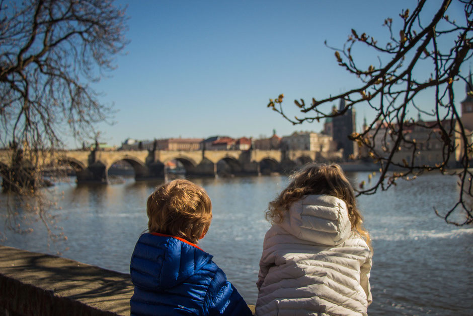 View of Charles Bridge from Kampa island with Kids in Prague