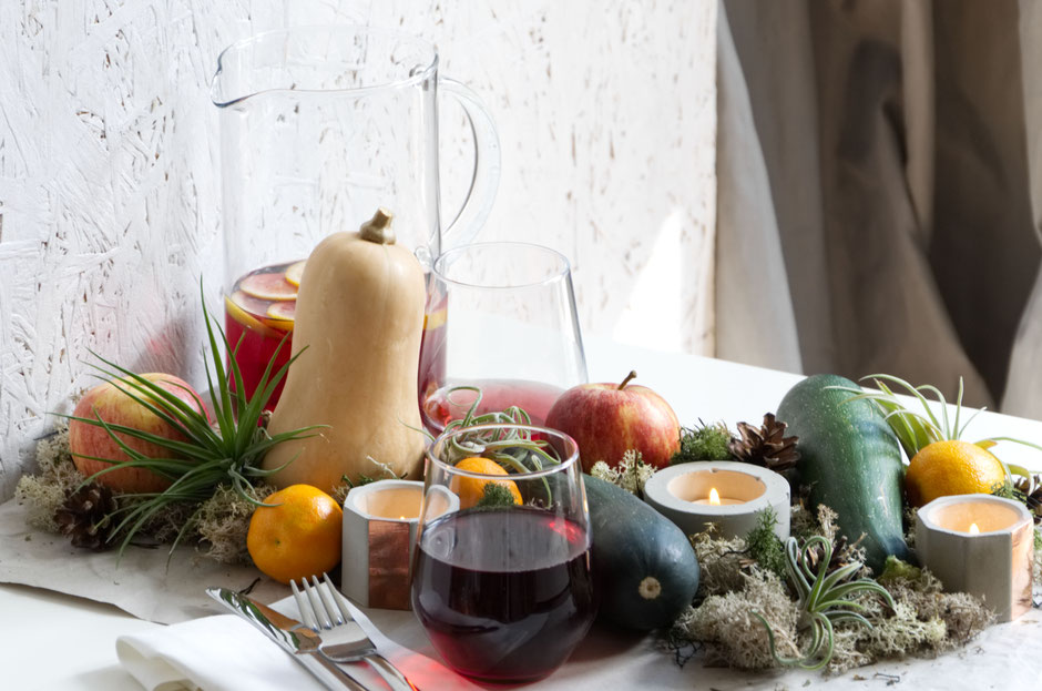 Halloween table scape with Air Plants, fresh produce, moss and concrete candle holders By PASiNGA Blog