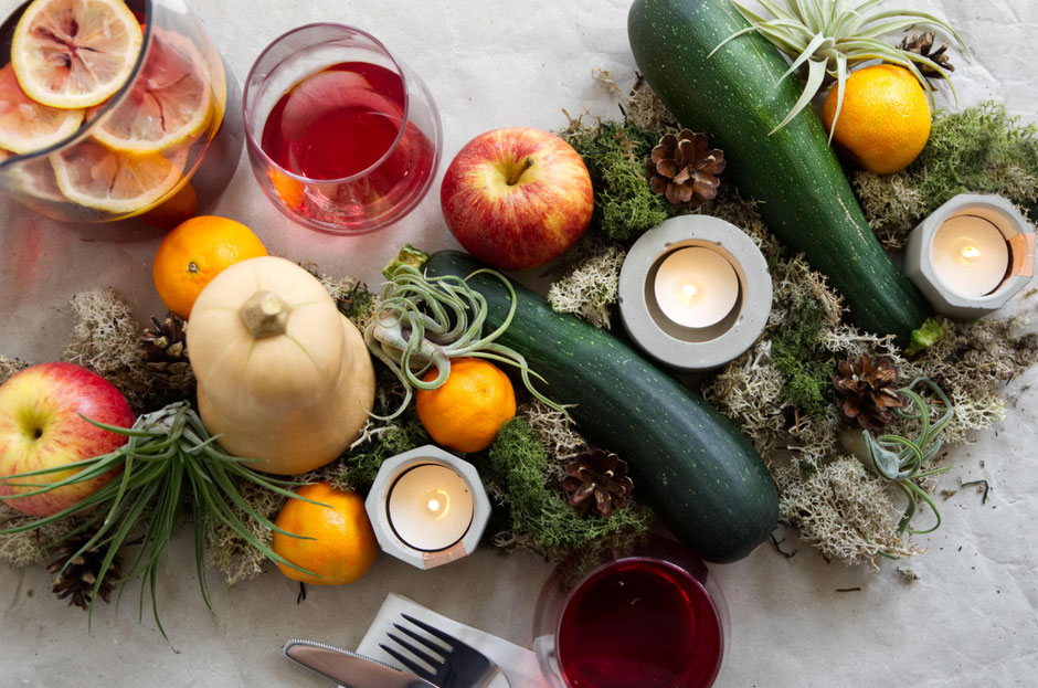 Autumn centrepiece celebrate Halloween with Air Plants, fresh produce, moss and geometric concrete candle holders 