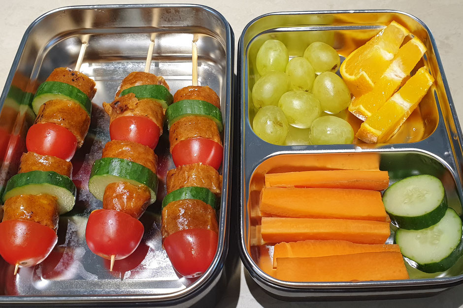 Sausage (free range, antibiotic, hormone free), cucumber and baby tomato skewers, grapes, carrots and orange. All organic.