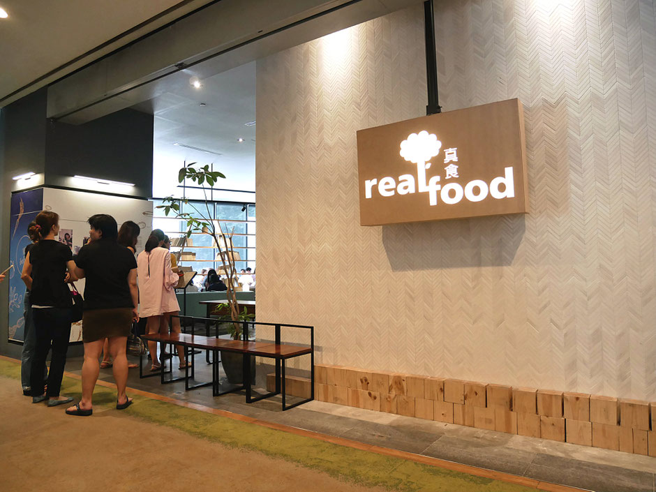 People queuing up at the entrance of Real Food Cafe Orchard Central on Friday lunchtime