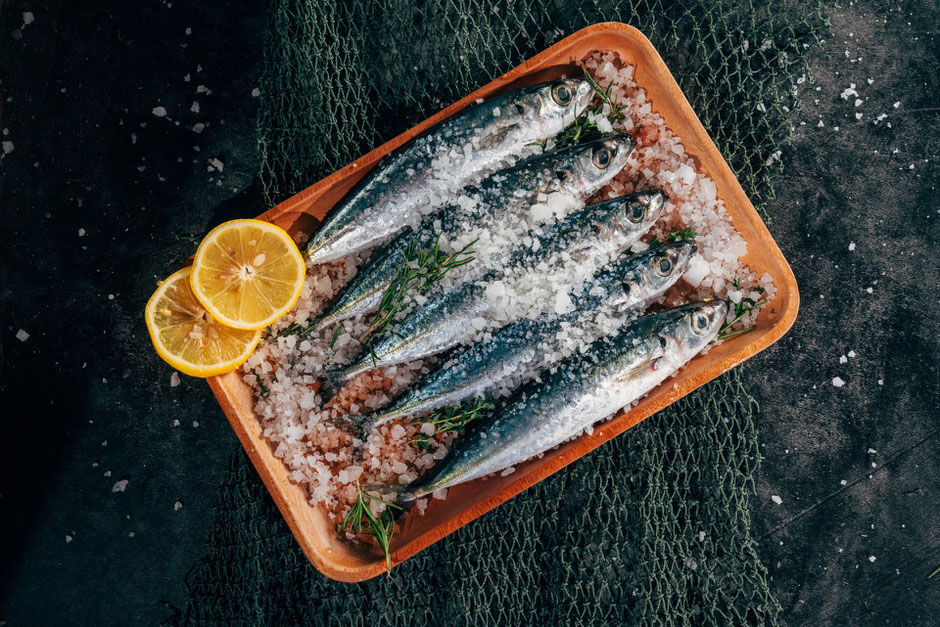 Small fatty fish like mackerel, anchovies, sardines and herring have a short life so have accumulated less toxicity than larger fish. They are also always wild.