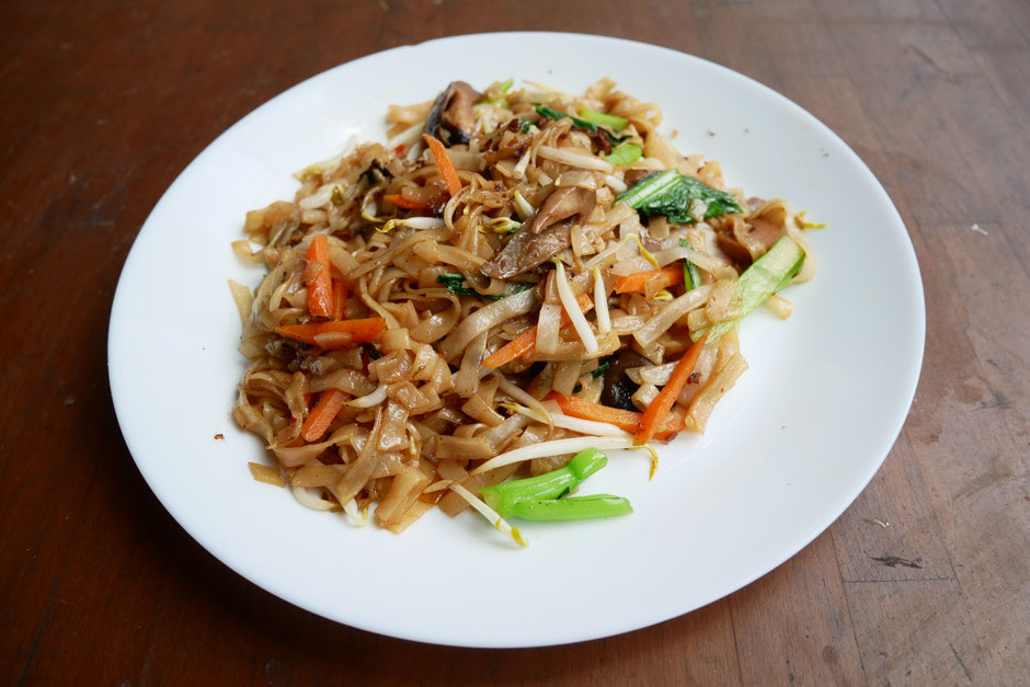 Lightly pan-fried kway teow with four simple ingredients carrots, mushrooms, bean sprouts and chai sim