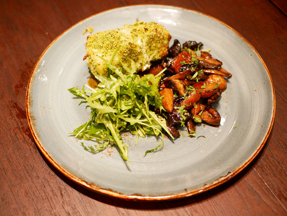 Organic Basil-crusted Glacier 51 Tooth Fish at Verde Kitchen served with roasted mushroom and rocket salad