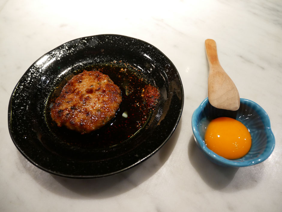 Chicken pate served with a raw egg yolk at the side at Bincho Yakitori singapore