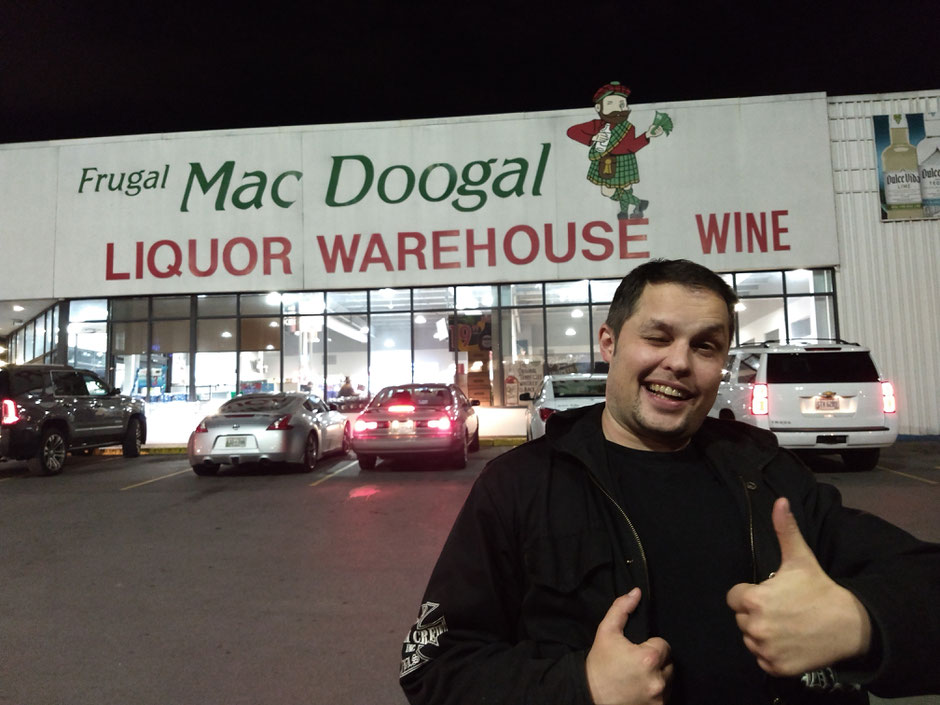 Frugal Mac Doogal Liquor Warehouse Phil Vanderkill cars parking lot thumbs up grin wink