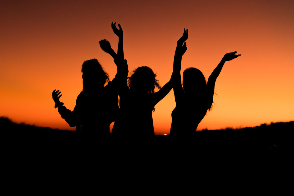 sunset celebration of 3 people