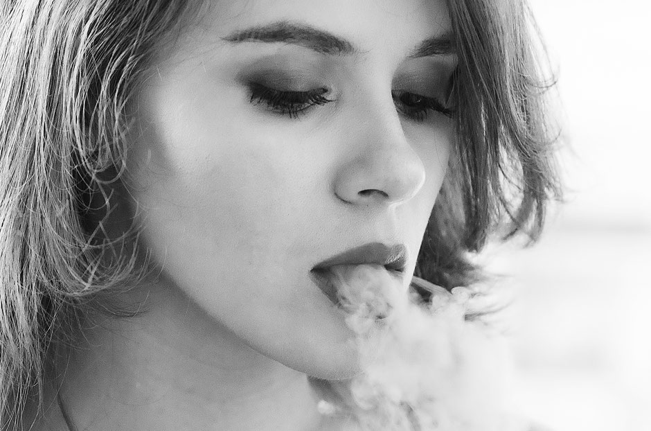 Black and white portrait of Julia Romanova smoking