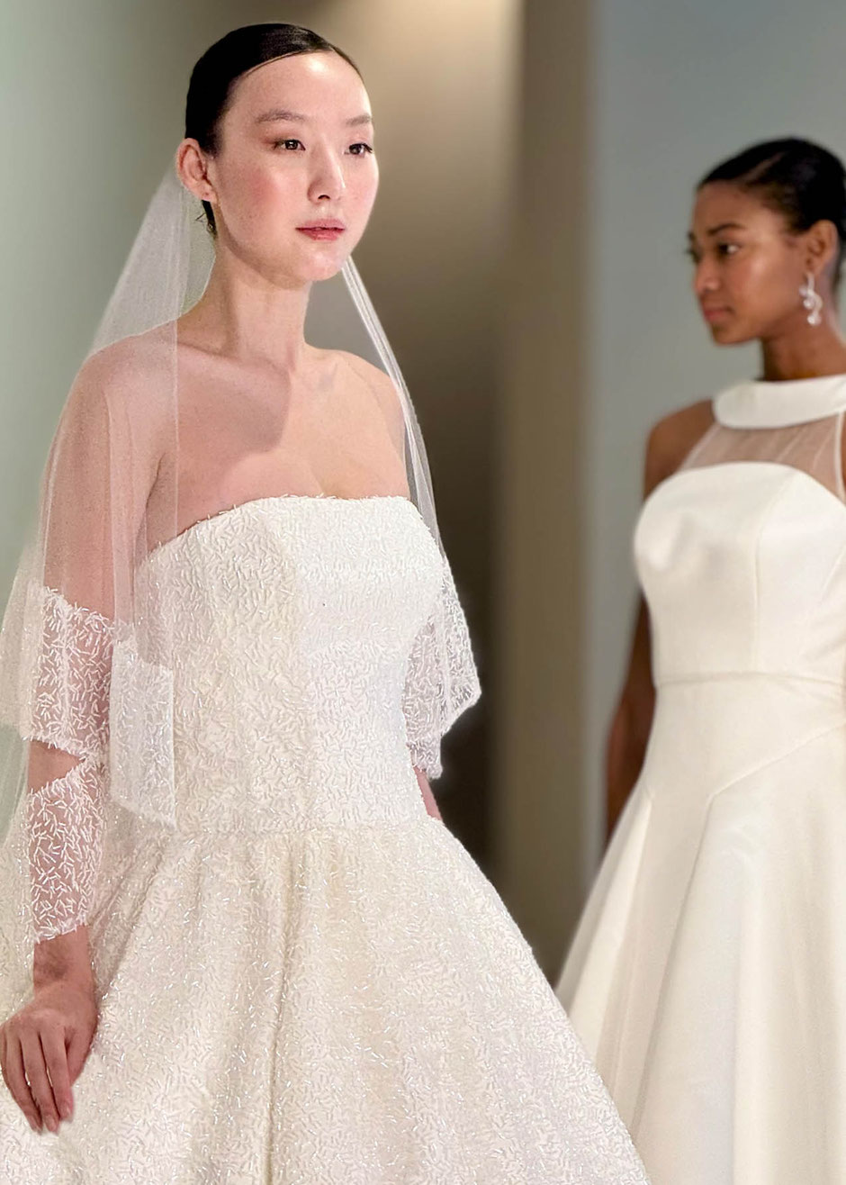 Young Japanese top model on the catwalk wearing a Jesus Peiro bridal dress