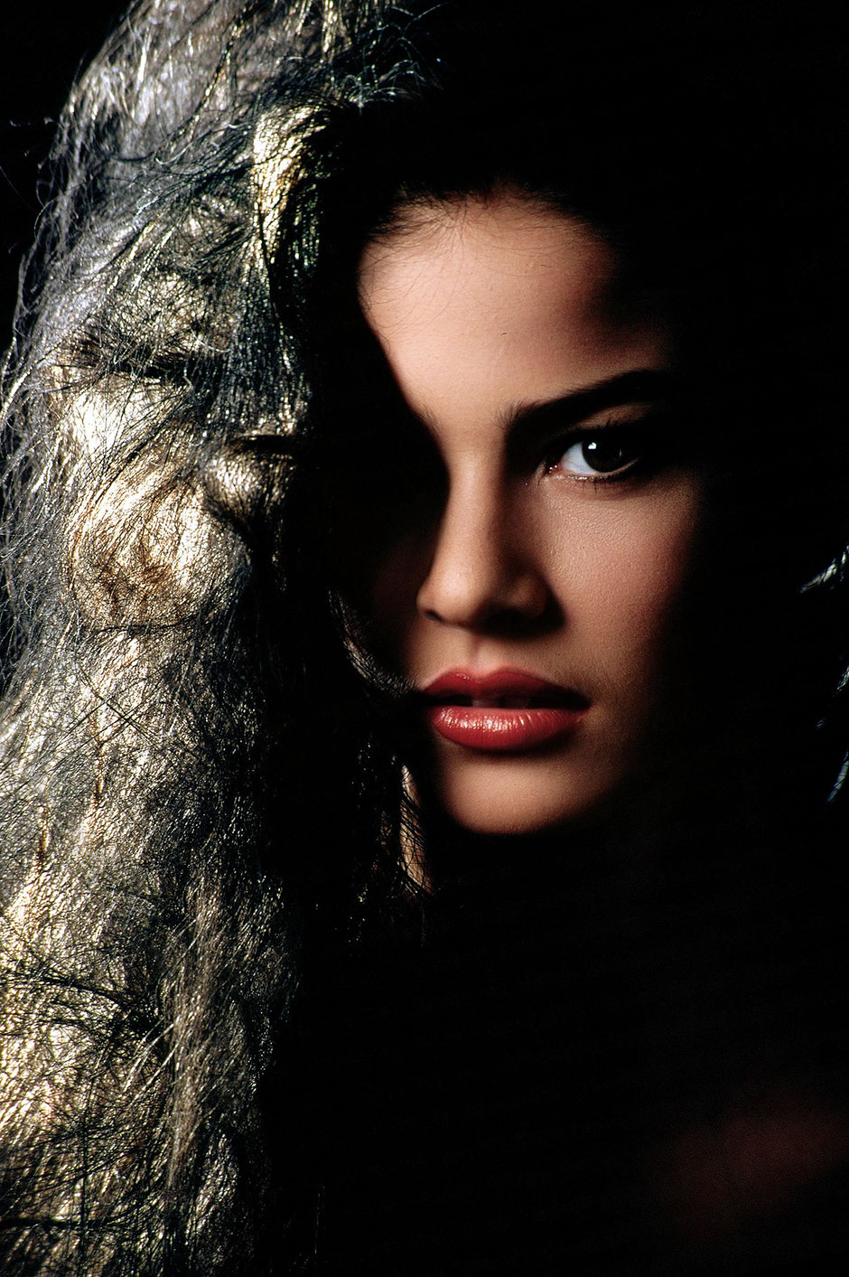 A portrait from a young girl with make up and a special hair styling