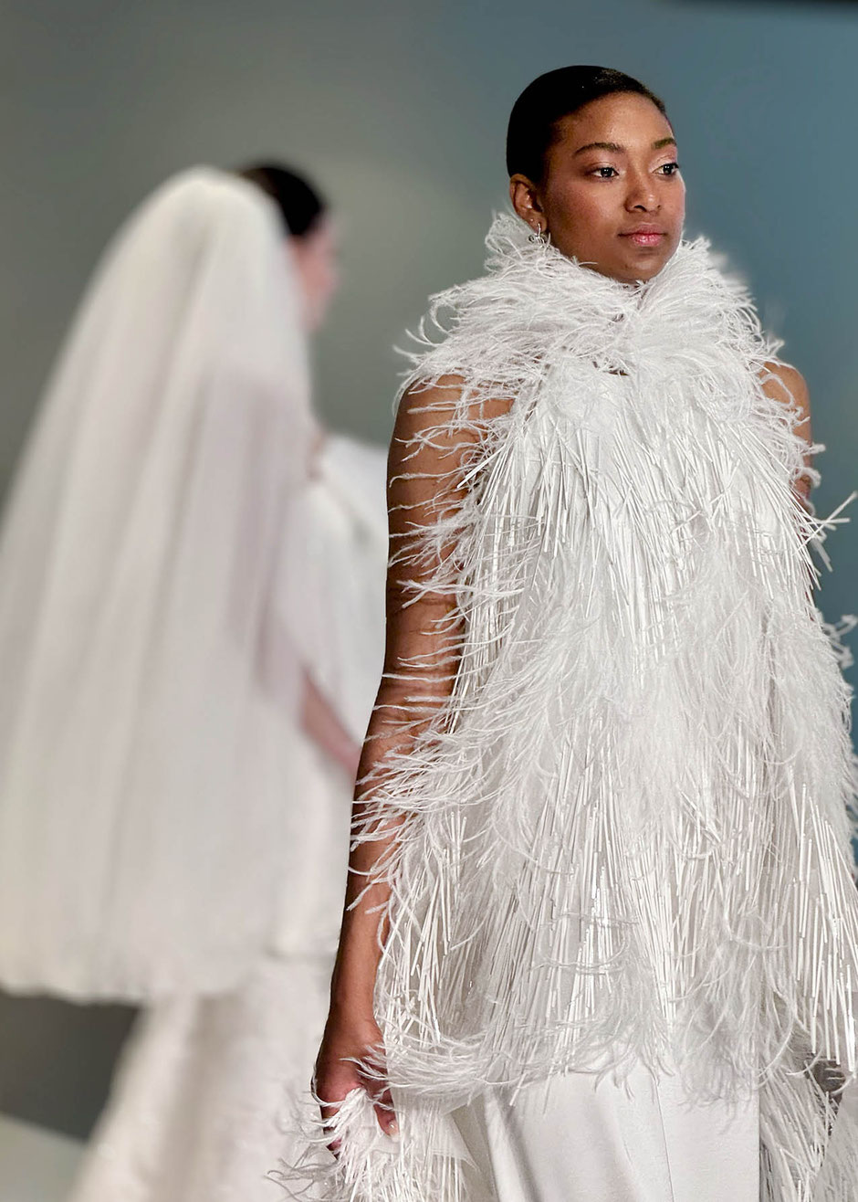 Young afro American supermodel on the catwalk in Barcelona wearing a Jesus Peiro bridal dress