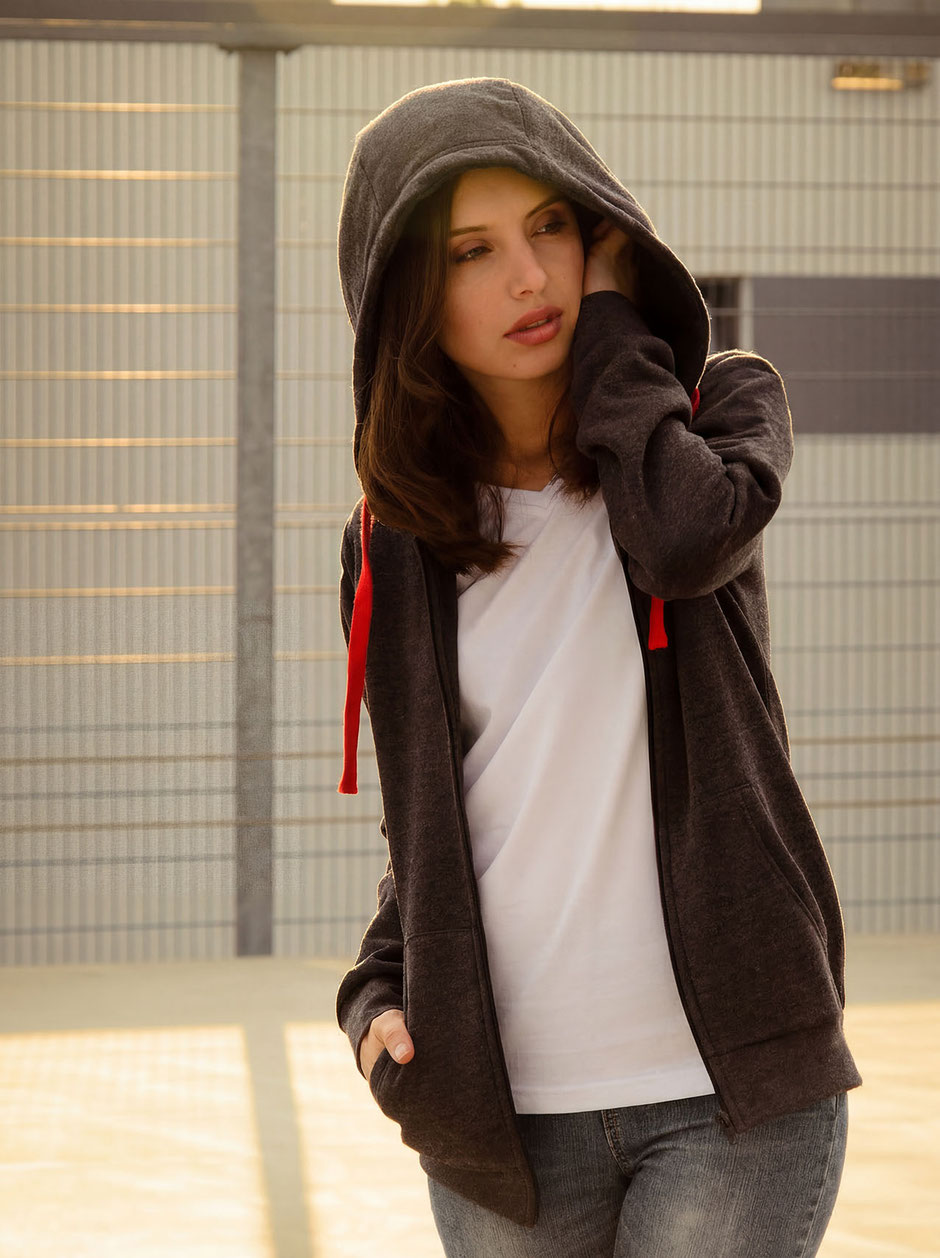 Fashion Photo from Katja with hoodie during sundown on top of a parking garage in Munich