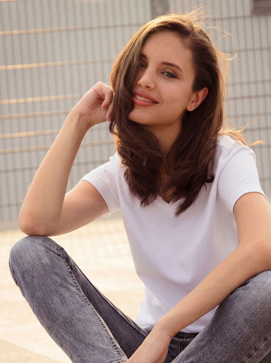 Fashion Photo with Katja smiling during sundown on top of a parking garage in Munich