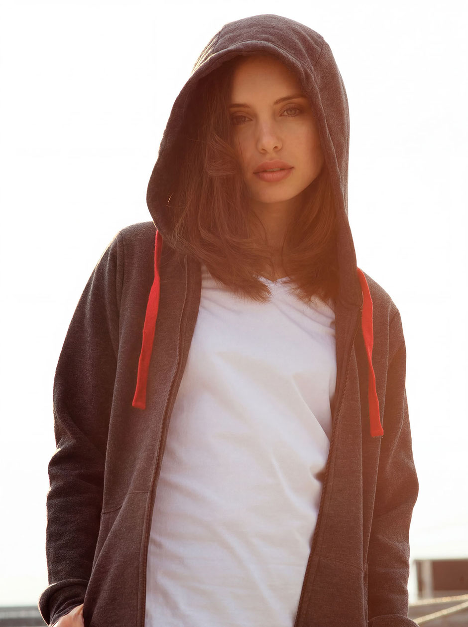 Fashion Photo of Katja with shirt and hoodie during sundown on top of a parking garage in Munich