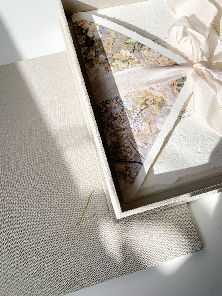 Box with a fitted lid for wedding invitations, lined with flax linen, closed with a silk ribbon and foil pressed logo