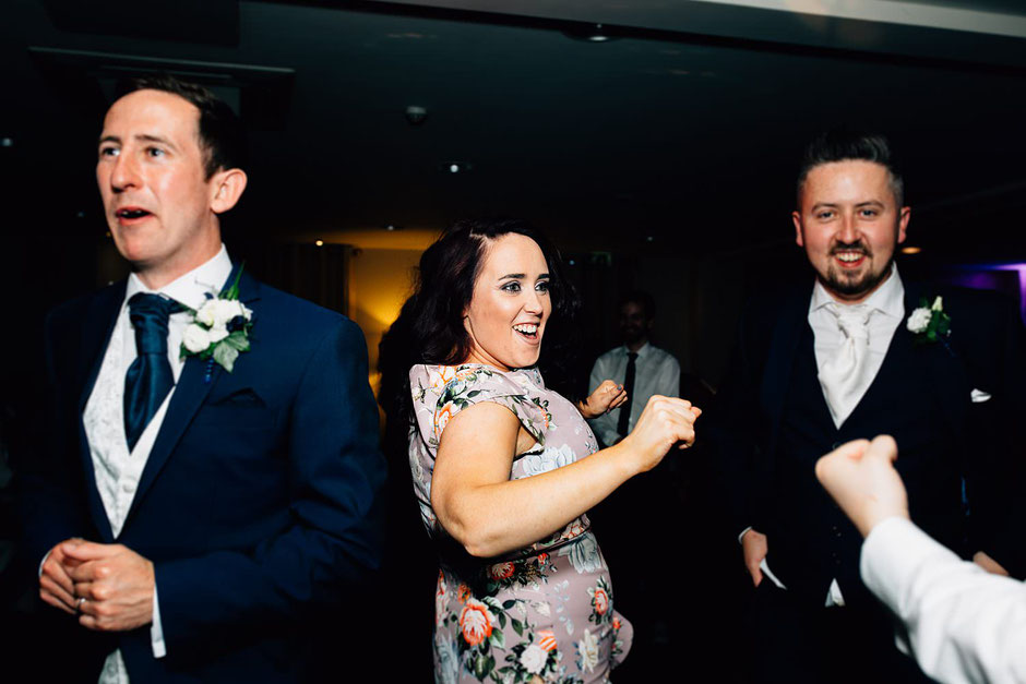people dancing at a wedding