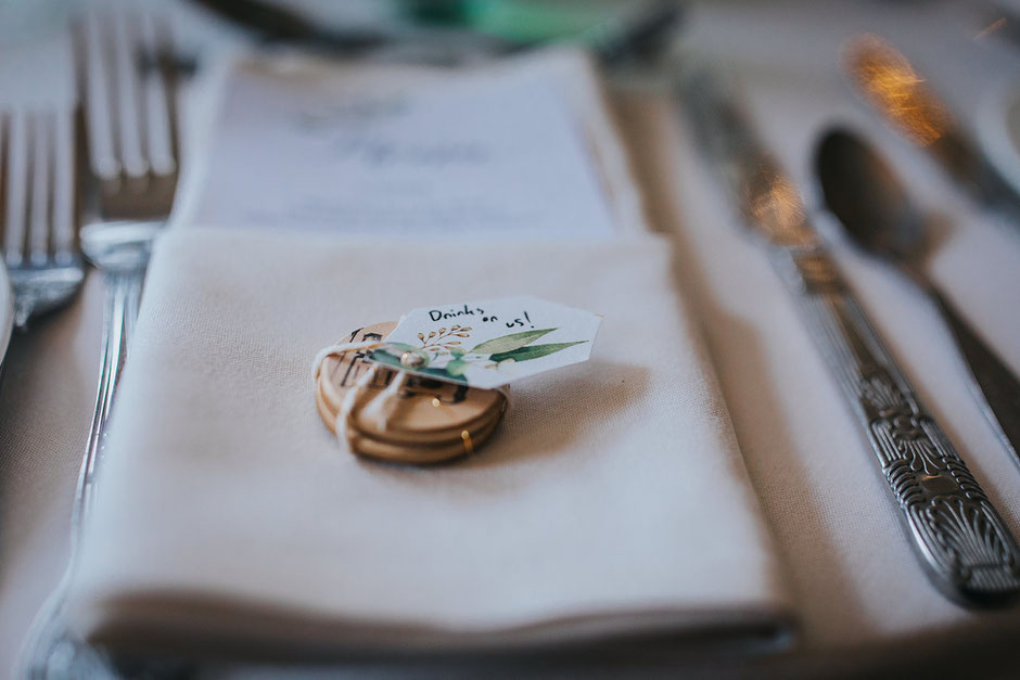 Detail photograph of some drinks tokens as a gift for wedding guests