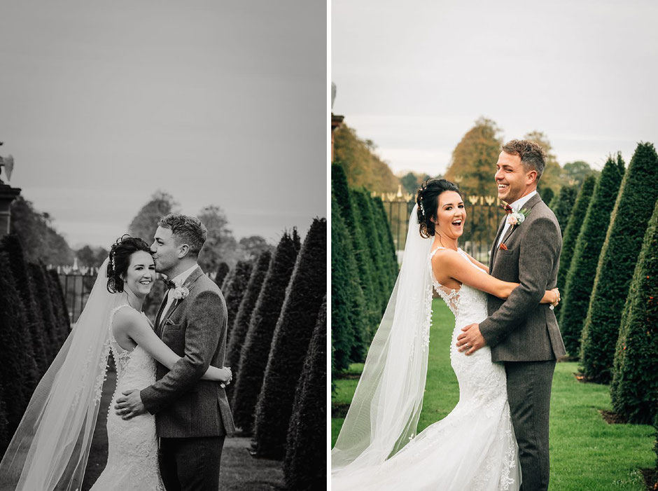 bride and groom posing for photographs in the grounds of Knowsley hall