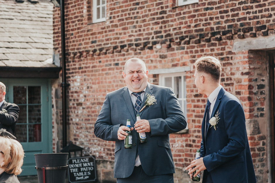 candid shot of a wedding guest at meols hall